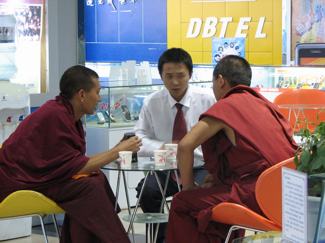Monks buying cell phones. Lhasa, Tibet.